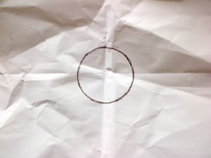 A circle drawn on a crumpled piece of paper, from The Hudsucker Proxy