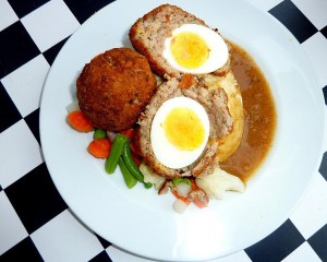 Whereas the Manchester egg uses a pickled egg wrapped in a mixture of pork meat and Lancashire black pudding